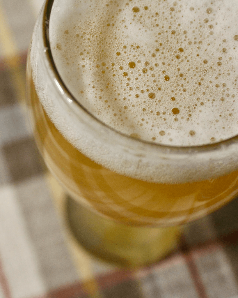 A foamy head of Hefeweizen beer