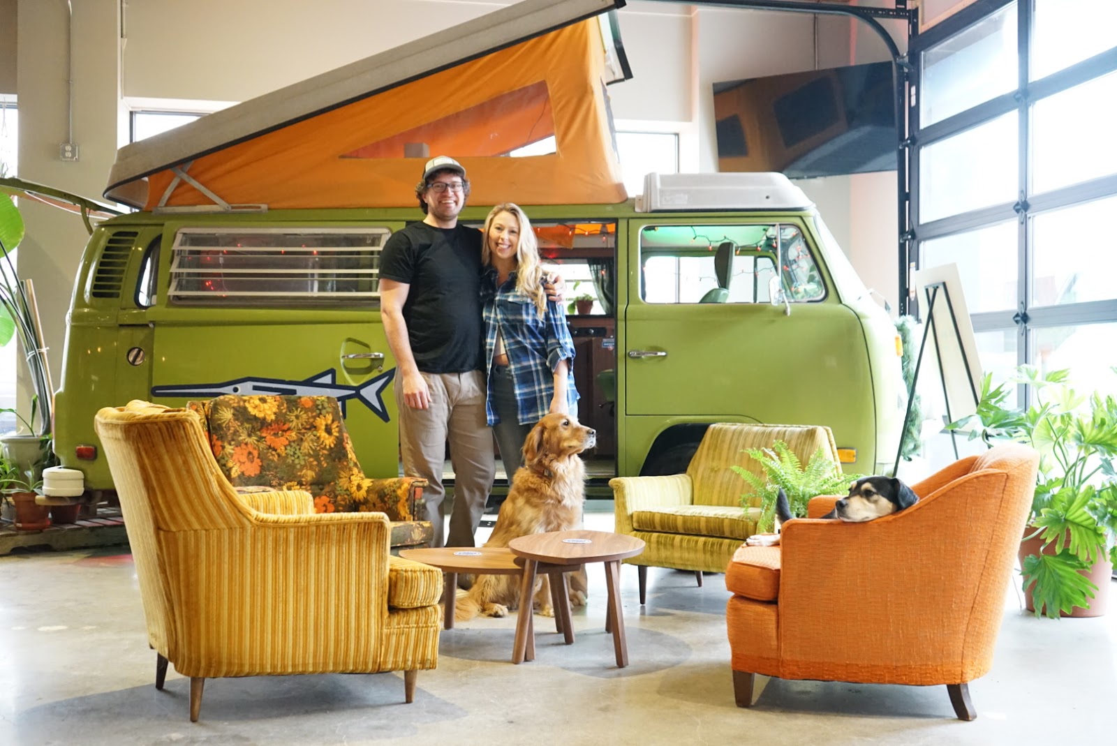 Paddlefish co-owner Dave Long with creative director Natalie Anderson and their dogs